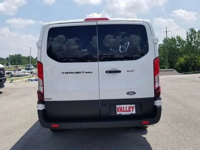 New 2026 Oxford White Ford Passenger Van XLT image 11