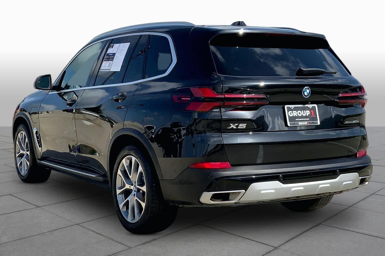 Used 2025 Black Sapphire Metallic BMW xDrive50e image 12