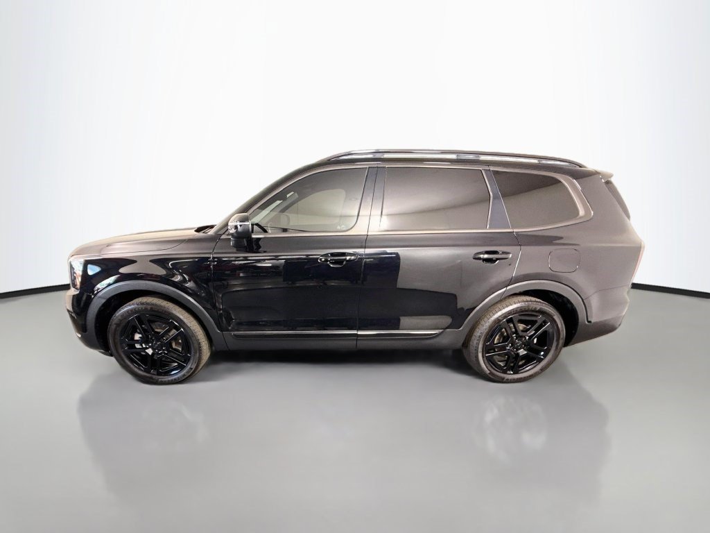 Used 2025 Ebony Black Kia EX X-Line image 4