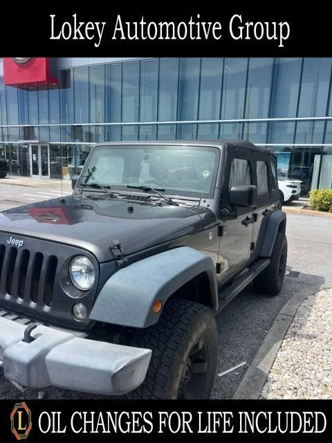 Used 2016 Gray Jeep Unlimited Sport image 1