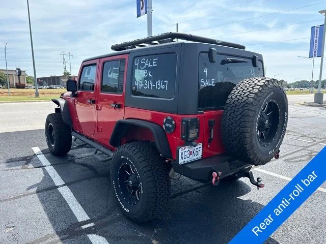 Used 2015 Firecracker Red Jeep Unlimited Sport image 10