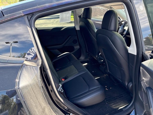 Used 2023 Solid Black Tesla Performance image 14