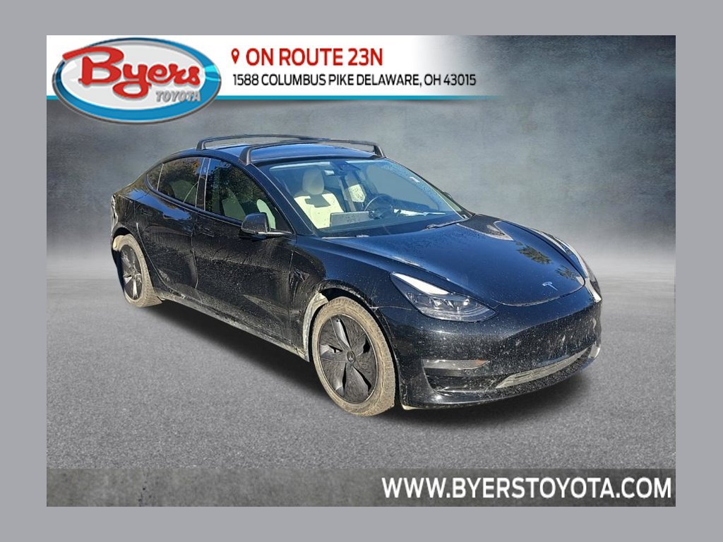 Used 2021 Solid Black Tesla Standard Range Plus image 1