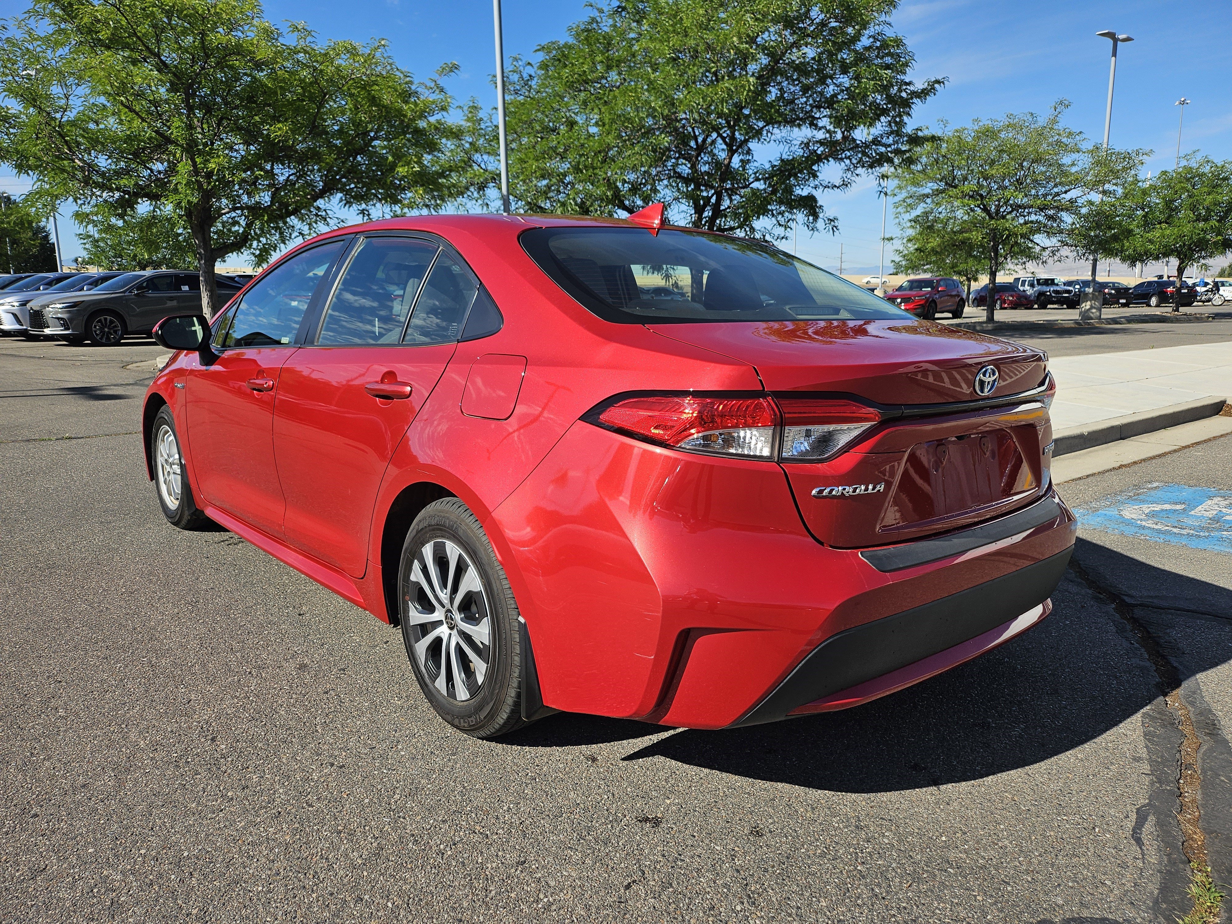 Used 2021 Barcelona Red Metallic Toyota LE image 8