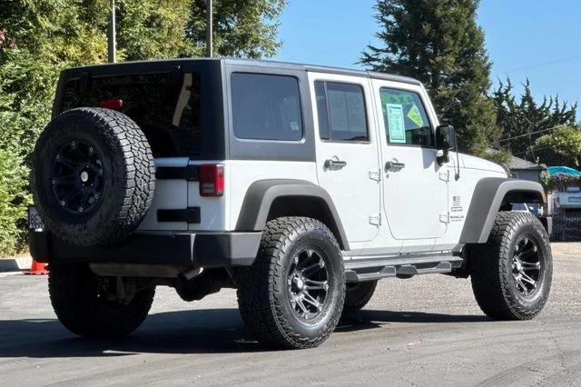 Used 2016 White Jeep Unlimited Sport image 4