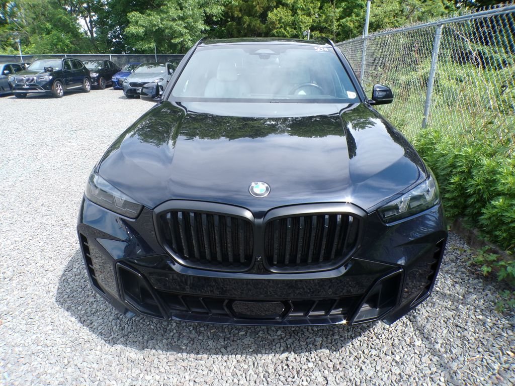 Certified Used 2024 Carbon Black Metallic BMW xDrive40i image 2