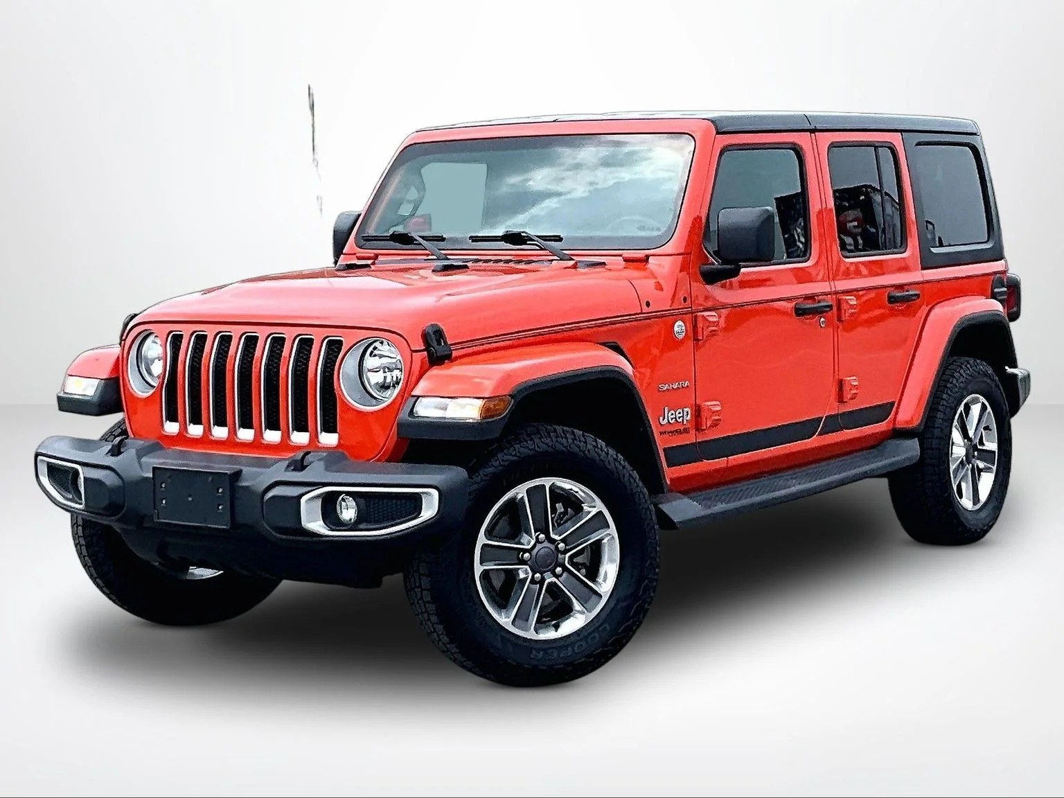 Used 2018 Orange Jeep Unlimited Sahara image 2