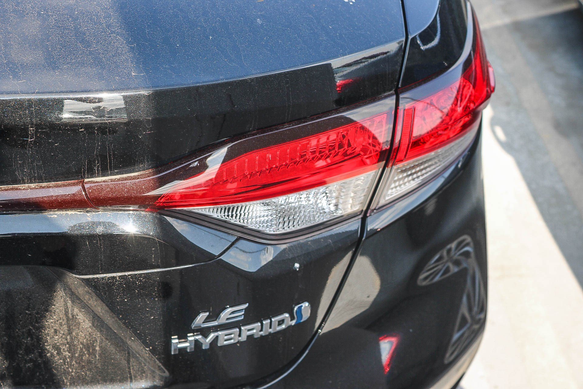 Used 2024 Midnight Black Metallic Toyota Hybrid LE image 14