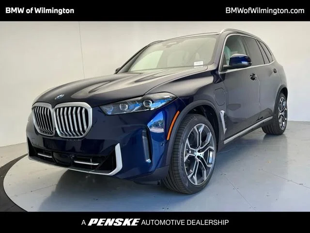 New 2026 Tanzanite Blue II Metallic BMW xDrive50e image 1
