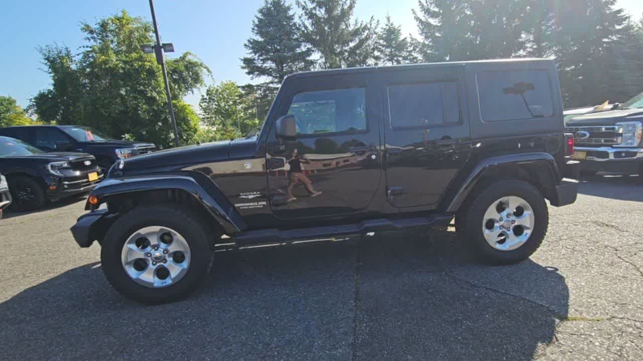 Used 2014 Black Clear Coat Jeep Sahara image 4