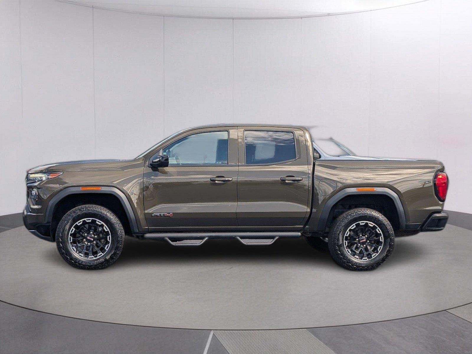 Used 2024 Deep Bronze Metallic GMC AT4 image 2