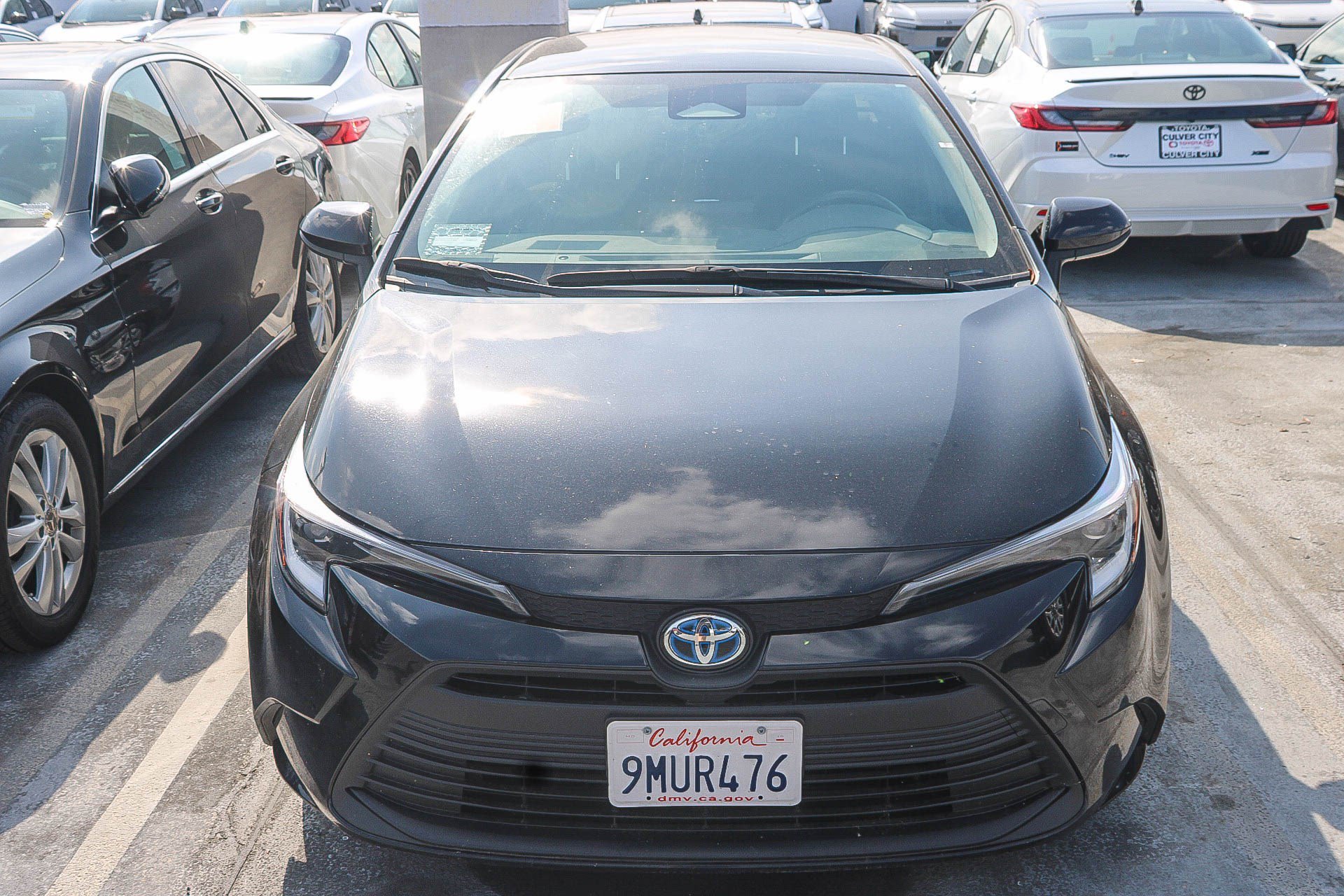 Used 2024 Midnight Black Metallic Toyota Hybrid LE image 3