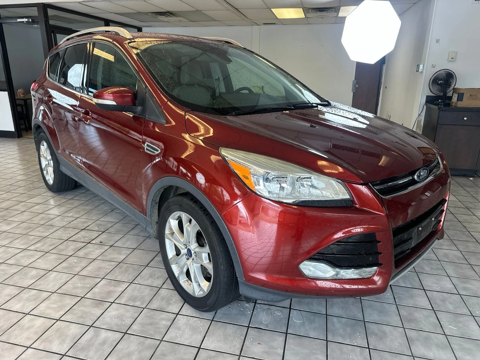 Used 2016 Orange Ford Titanium image 1