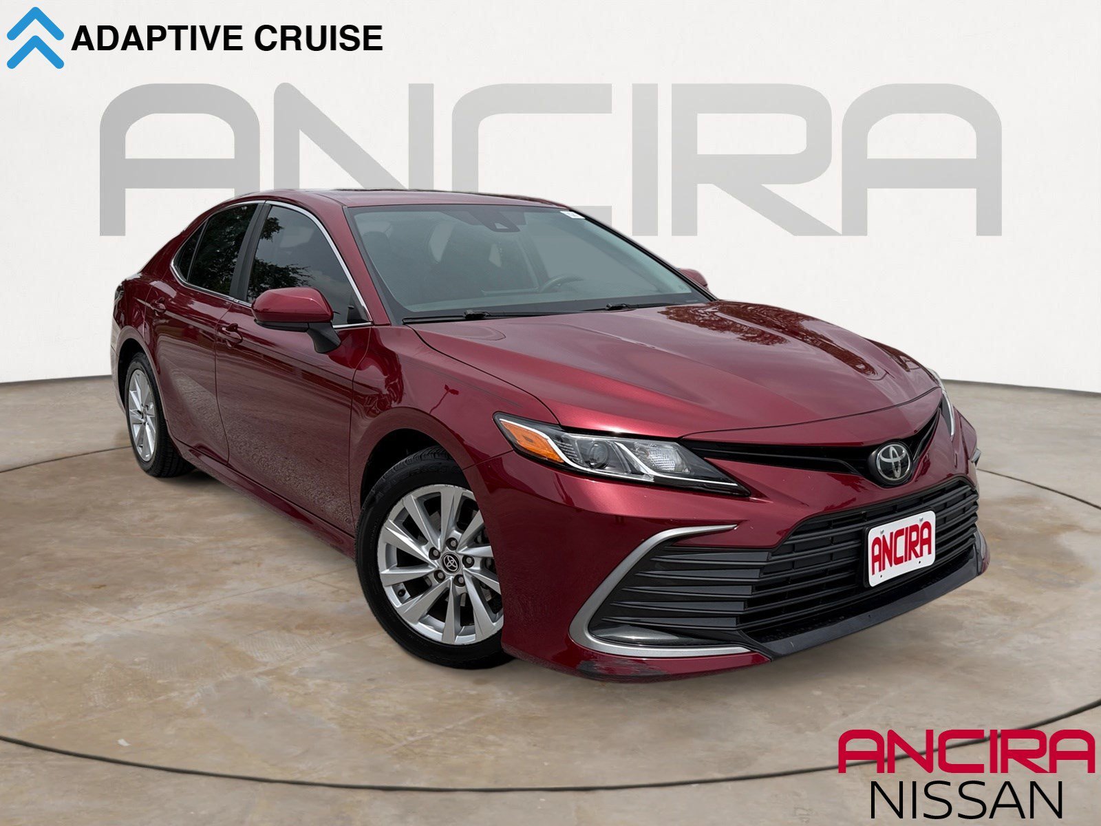 Used 2021 Supersonic Red Toyota LE image 1