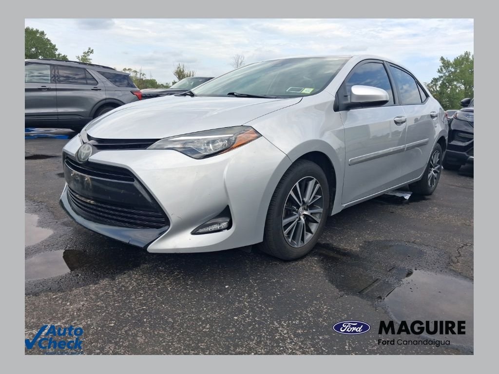 Used 2019 Classic Silver Metallic Toyota LE image 1