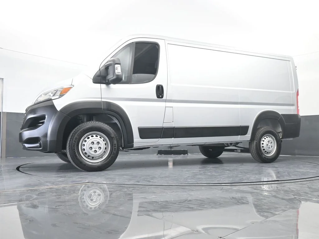 Used 2025 Bright Silver Clearcoat Metallic Ram Low Roof image 47