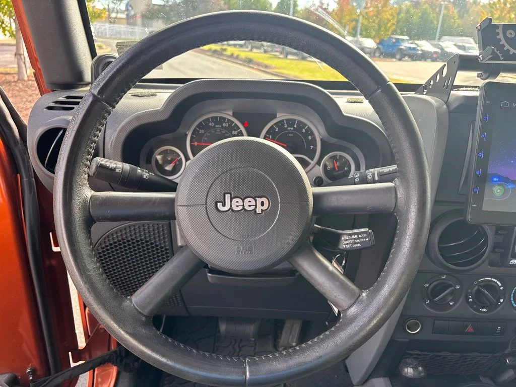 Used 2010 Orange Jeep Unlimited Sport image 11