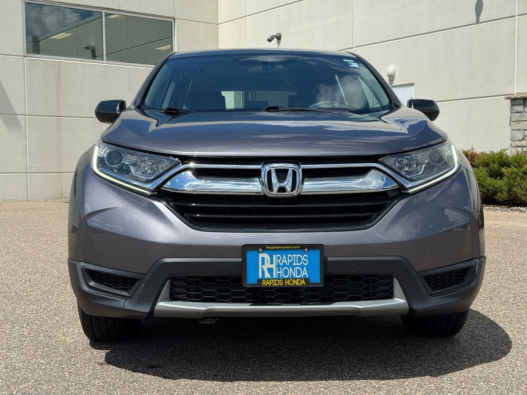 Used 2019 Honda CR-V LX with VIN 2HKRW6H33KH219001 for sale in Coon Rapids, Minnesota
