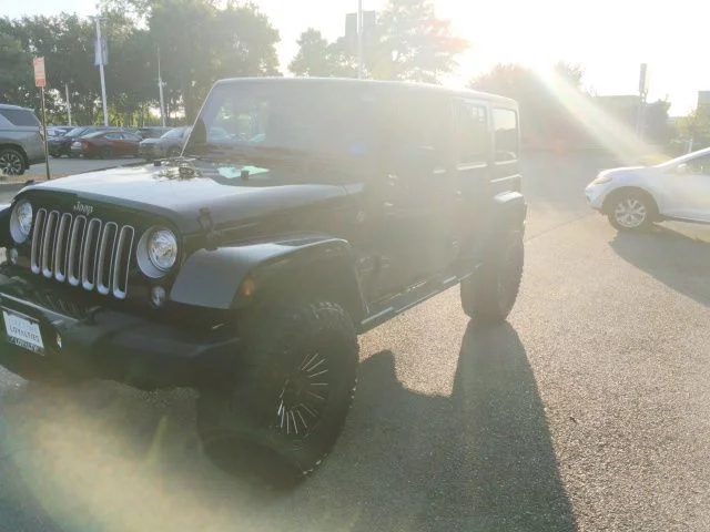 Used 2018 Black Jeep Unlimited Sahara image 2