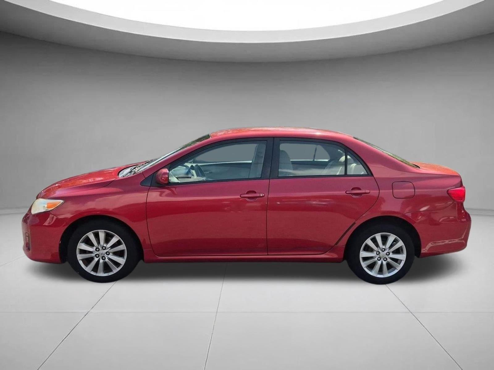 Used 2011 Barcelona Red Metallic Toyota LE image 2