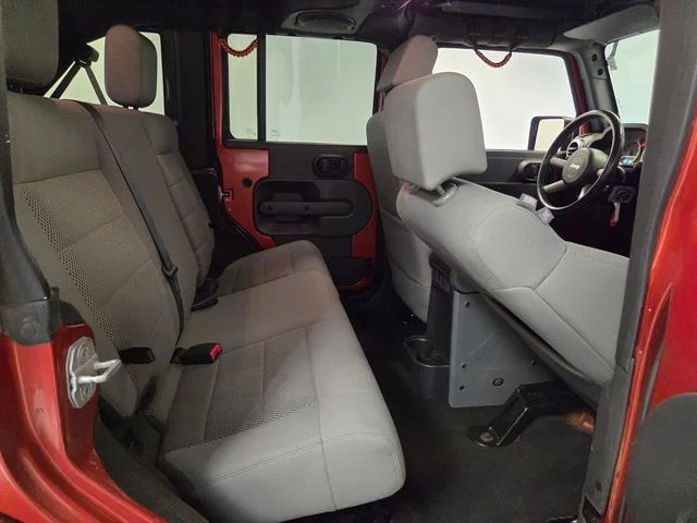 Used 2009 Orange Jeep Unlimited Sahara image 14