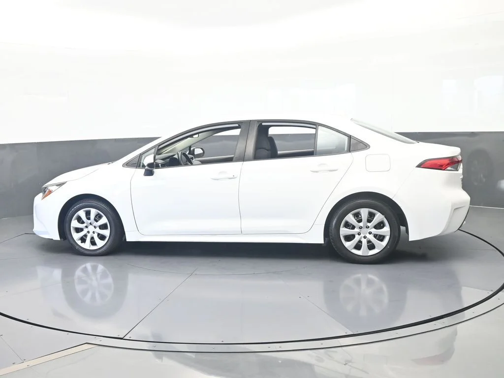 Used 2021 Super White Toyota LE image 2