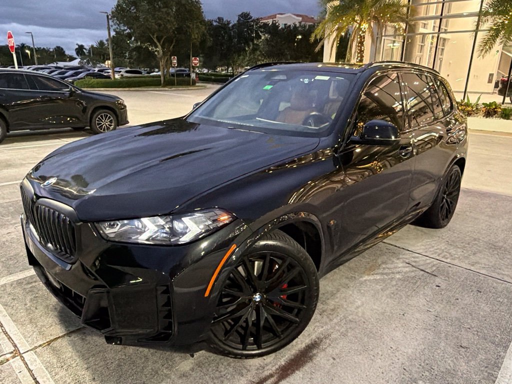 Certified Used 2024 Black Sapphire Metallic BMW xDrive40i image 1