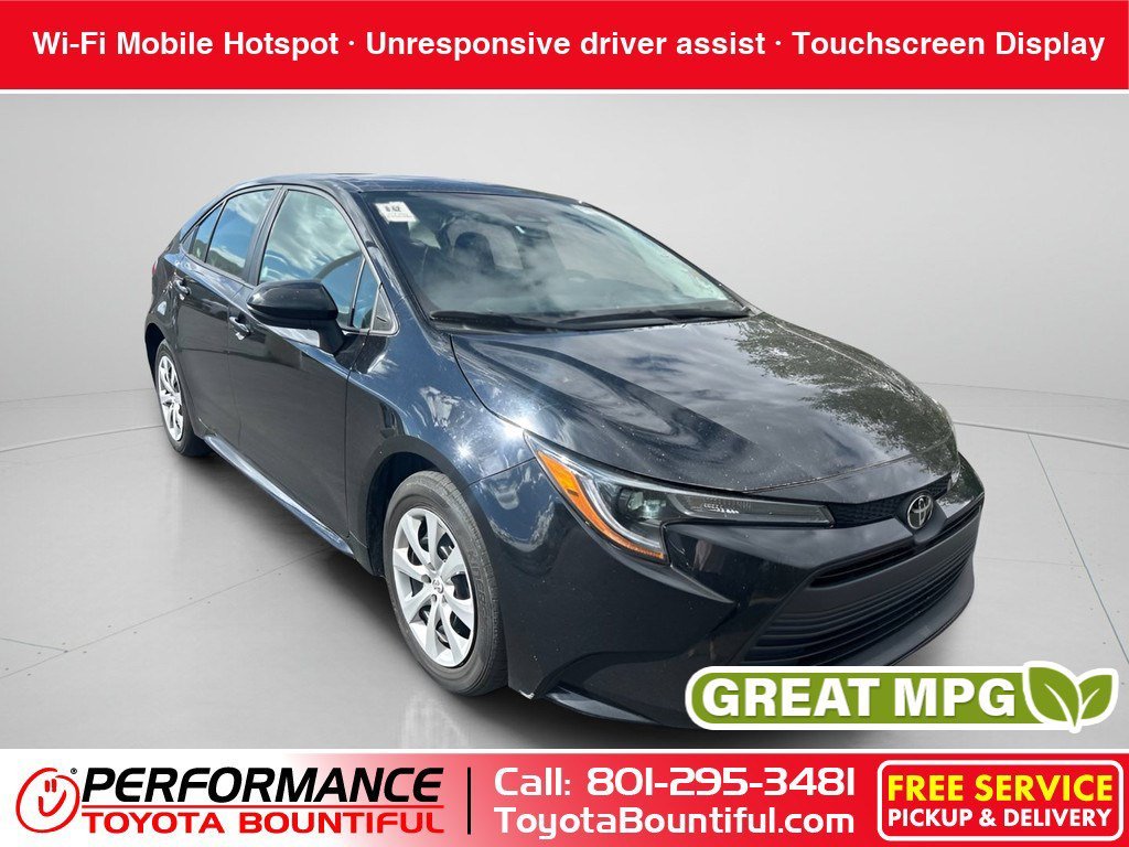 Used 2025 Midnight Black Metallic Toyota LE image 1