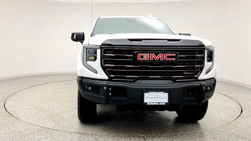 Used 2024 Summit White GMC 4WD Crew Cab 147"" AT4X image 2