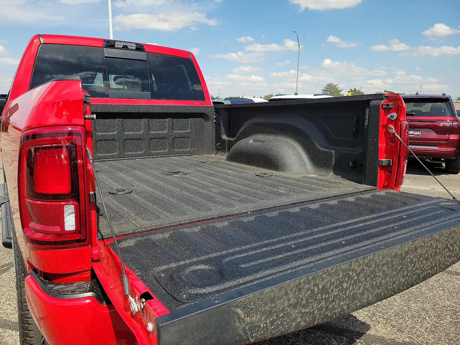 New 2026 Flame Red Ram LONE STAR CREW CAB 4X4 6