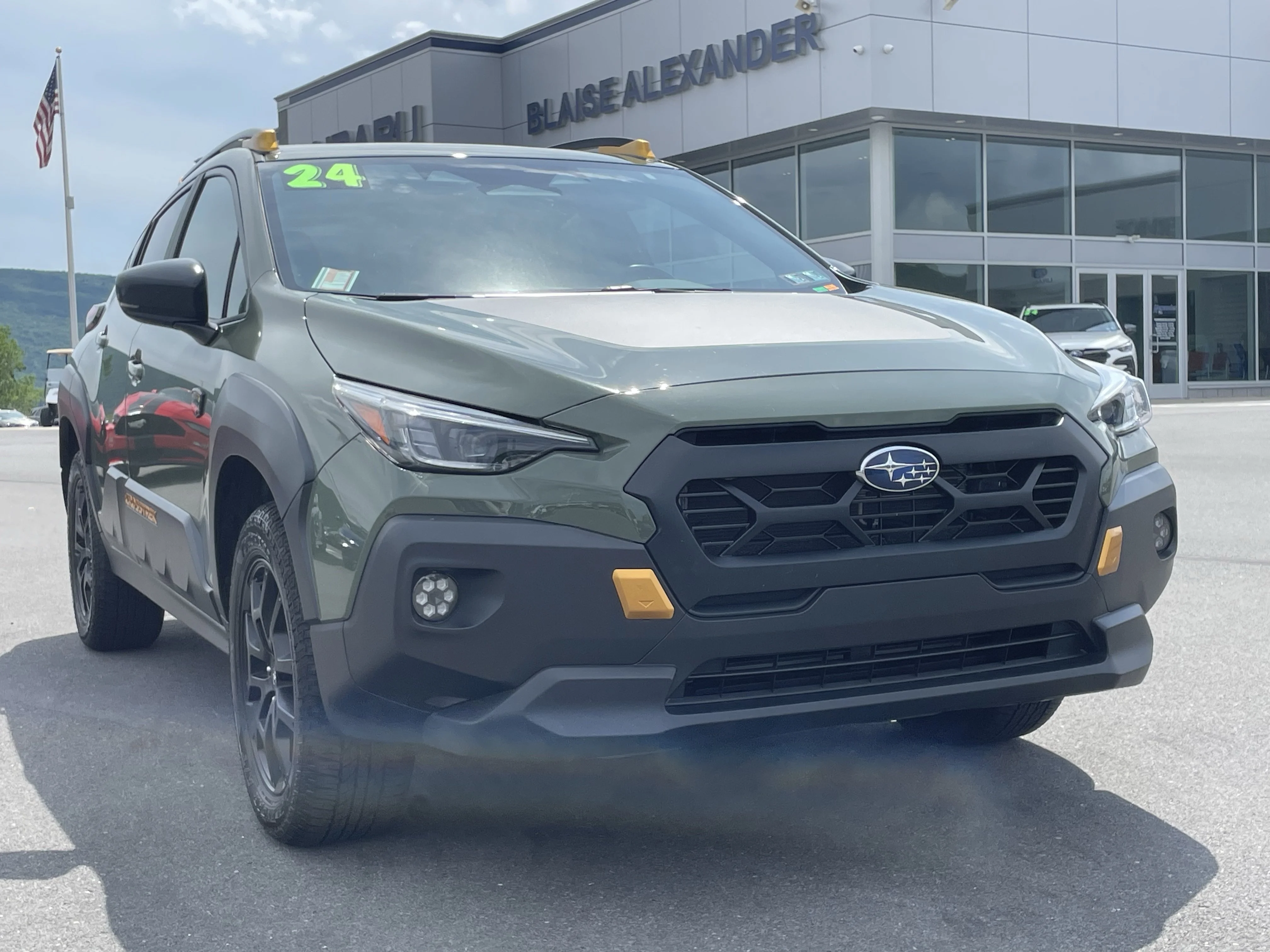 Used 2024 Alpine Green Subaru Wilderness image 1