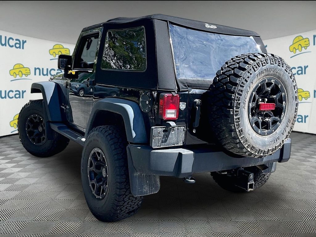 Used 2013 Black Clearcoat Jeep Sport image 3