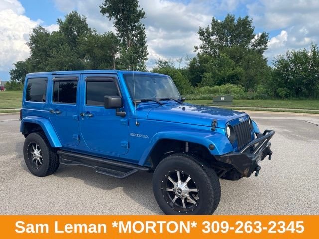 Used 2015 Blue Jeep Unlimited Sahara image 1