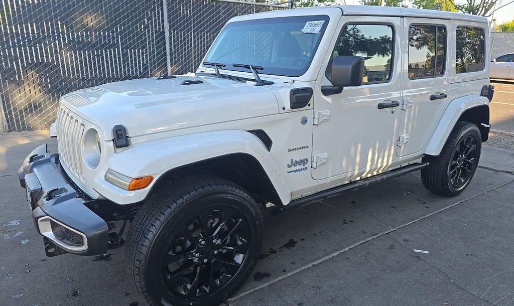 Used 2021 White/off-white Jeep Unlimited Sahara 4xe image 1