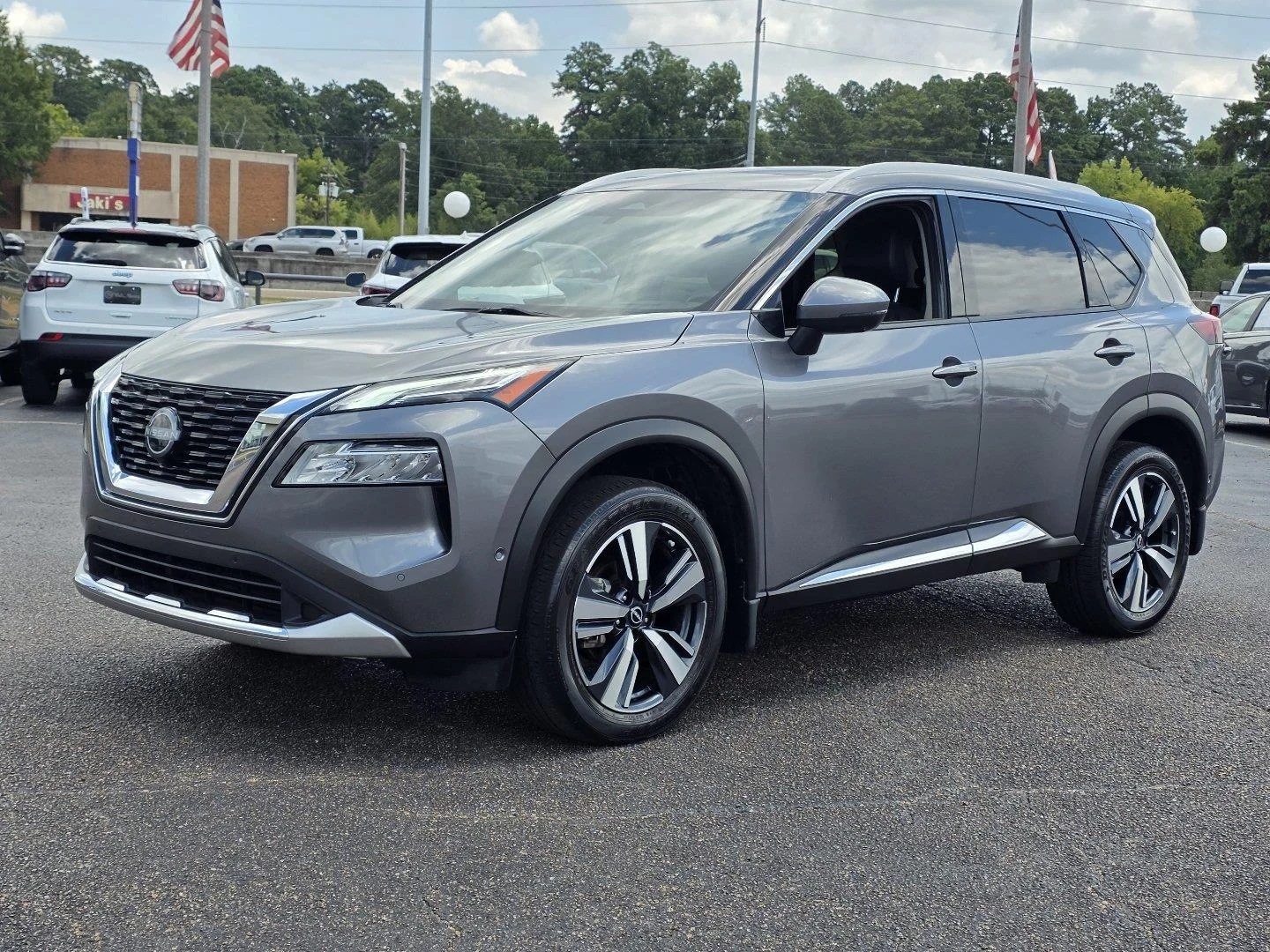 Used 2023 Gun Metallic Nissan Platinum image 1