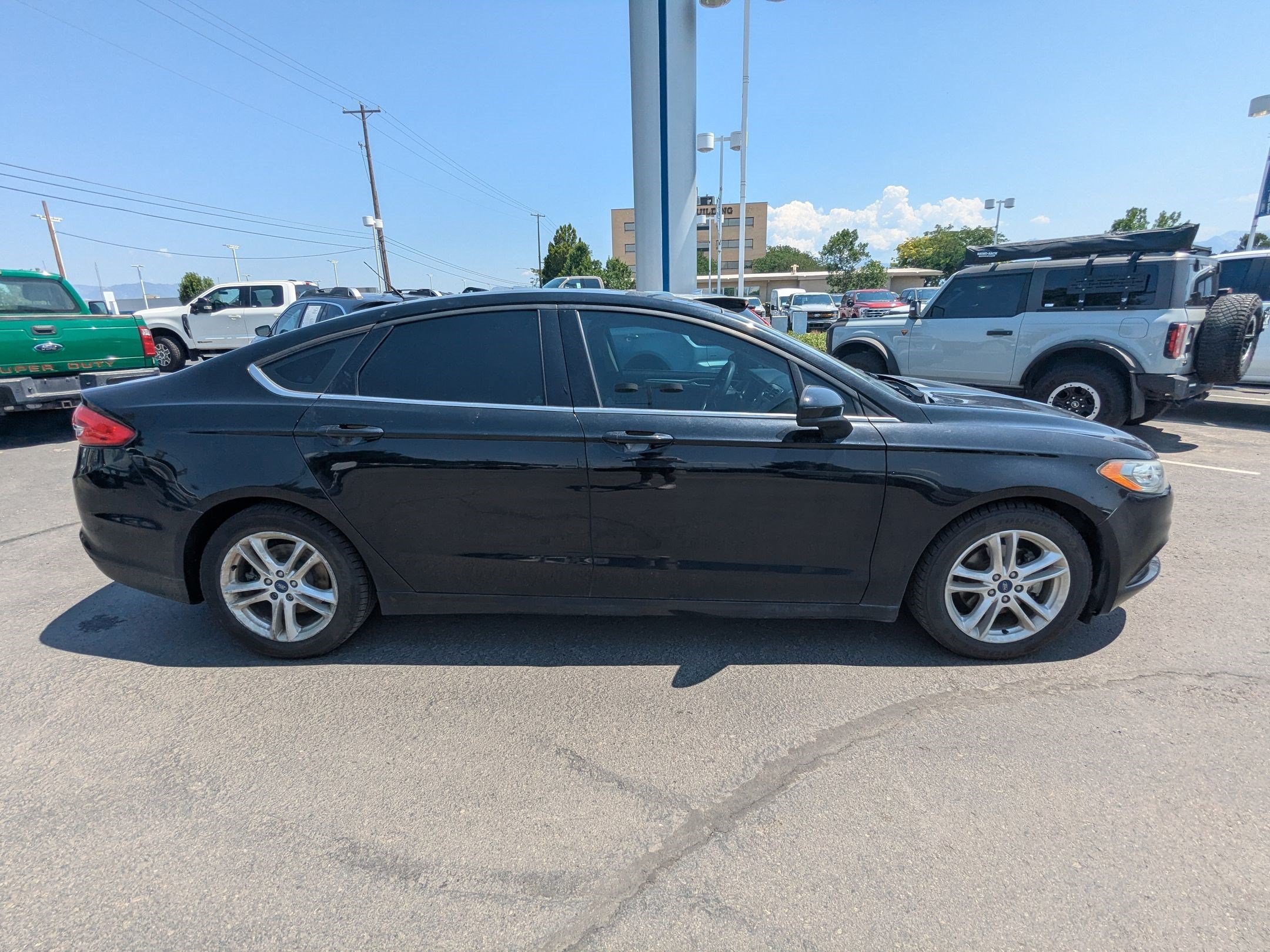 Used 2018 Ford Fusion SE with VIN 3FA6P0H7XJR206117 for sale in West Valley City, UT