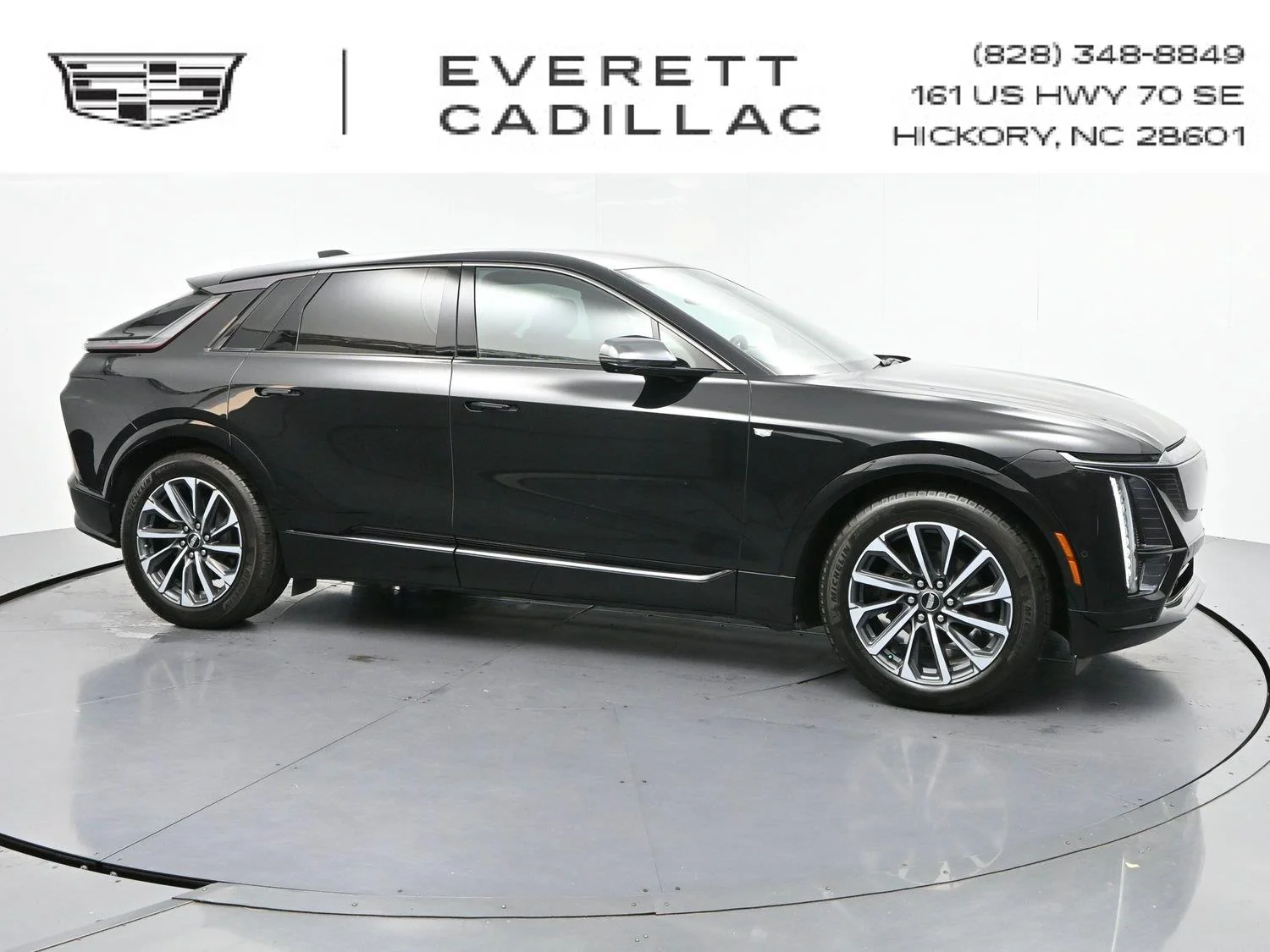 Used 2024 Stellar Black Metallic Cadillac Sport 1 image 1