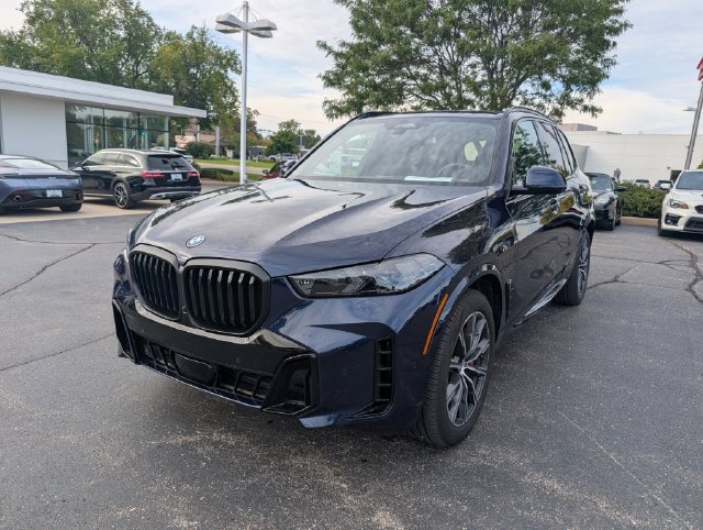 Certified Used 2026 Tanzanite Blue II Metallic BMW xDrive50e image 10