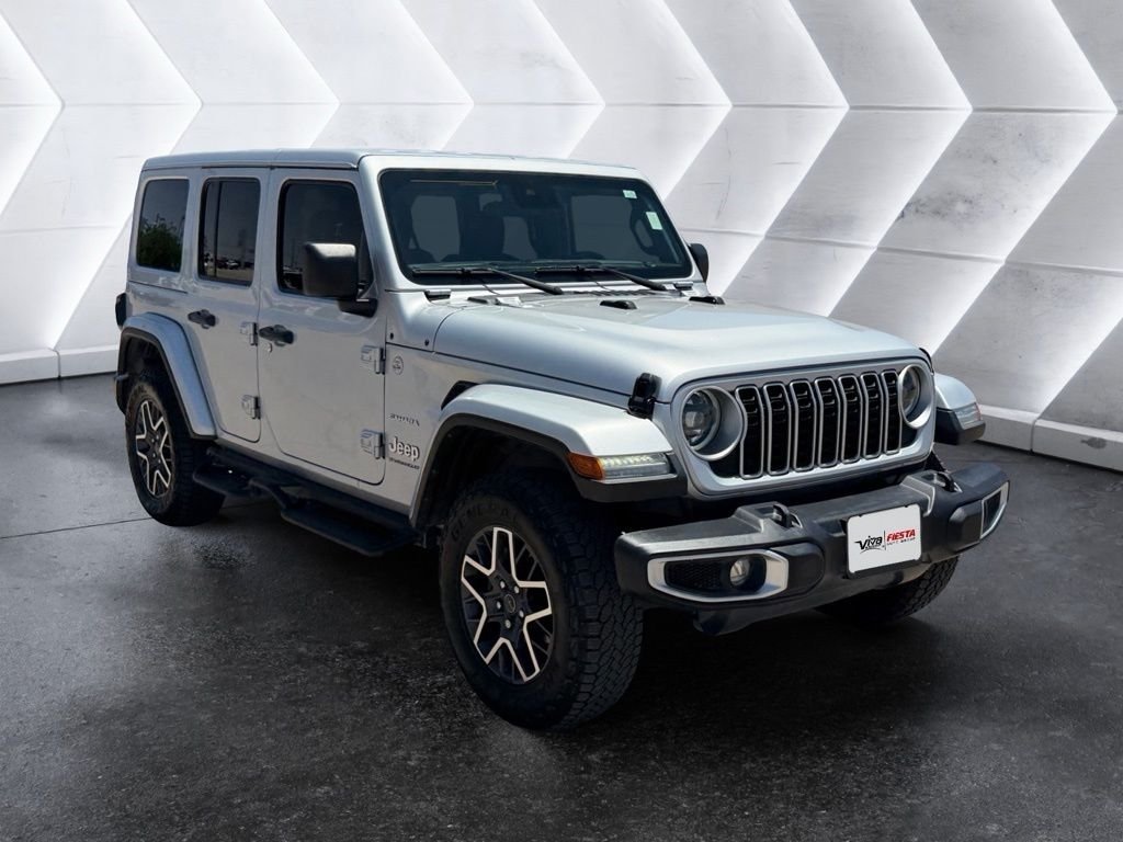 Certified Used 2024 Silver Jeep Sahara image 1