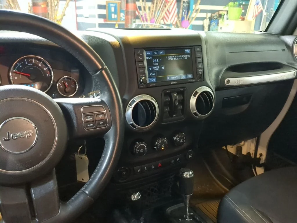 Used 2016 White Jeep Unlimited Sahara image 14