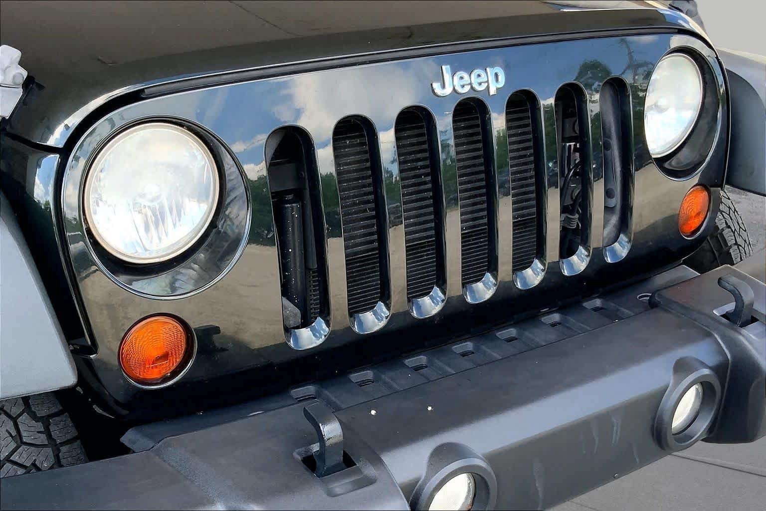 Used 2012 Black Forest Green Pearl Jeep Sport image 30