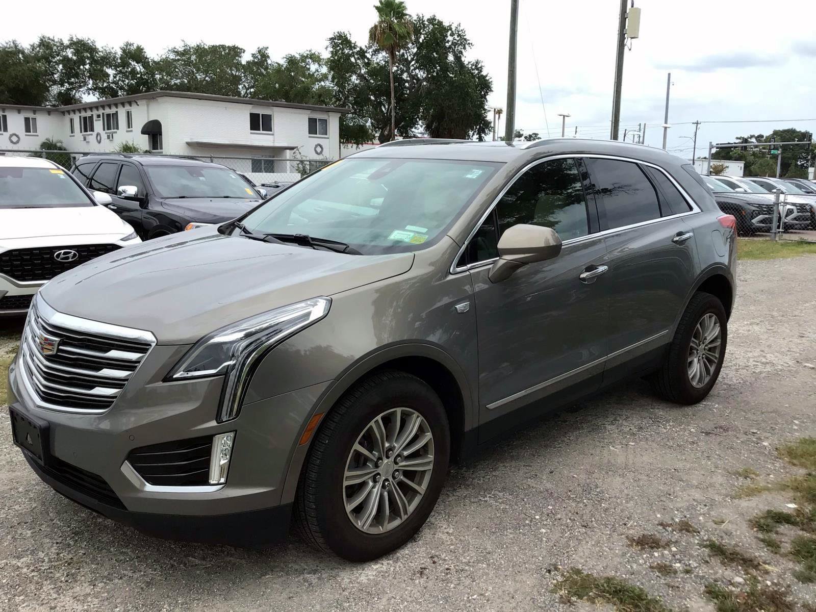 Used 2018 Bronze Dune Metallic CADILLAC Luxury image 1