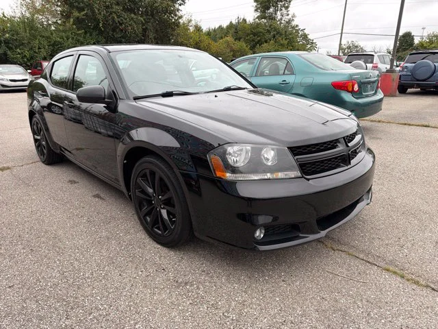 Used 2013 Black Dodge SXT image 1