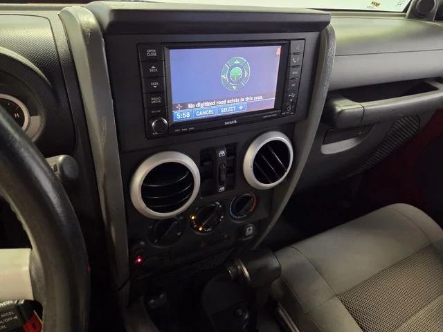 Used 2009 Orange Jeep Unlimited Sahara image 27