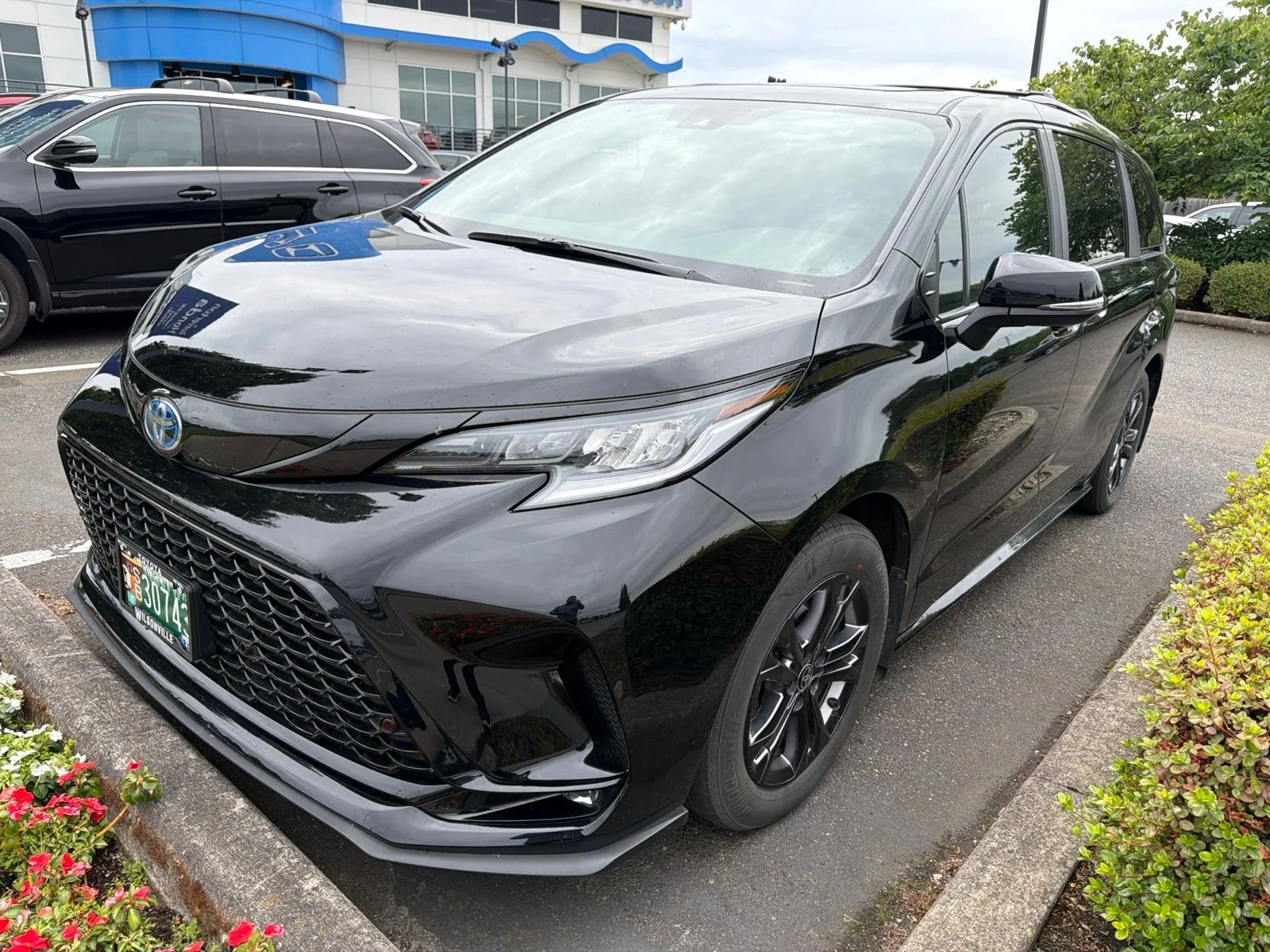 Used 2025 Midnight Black Metallic Toyota XSE 7 Passenger image 1