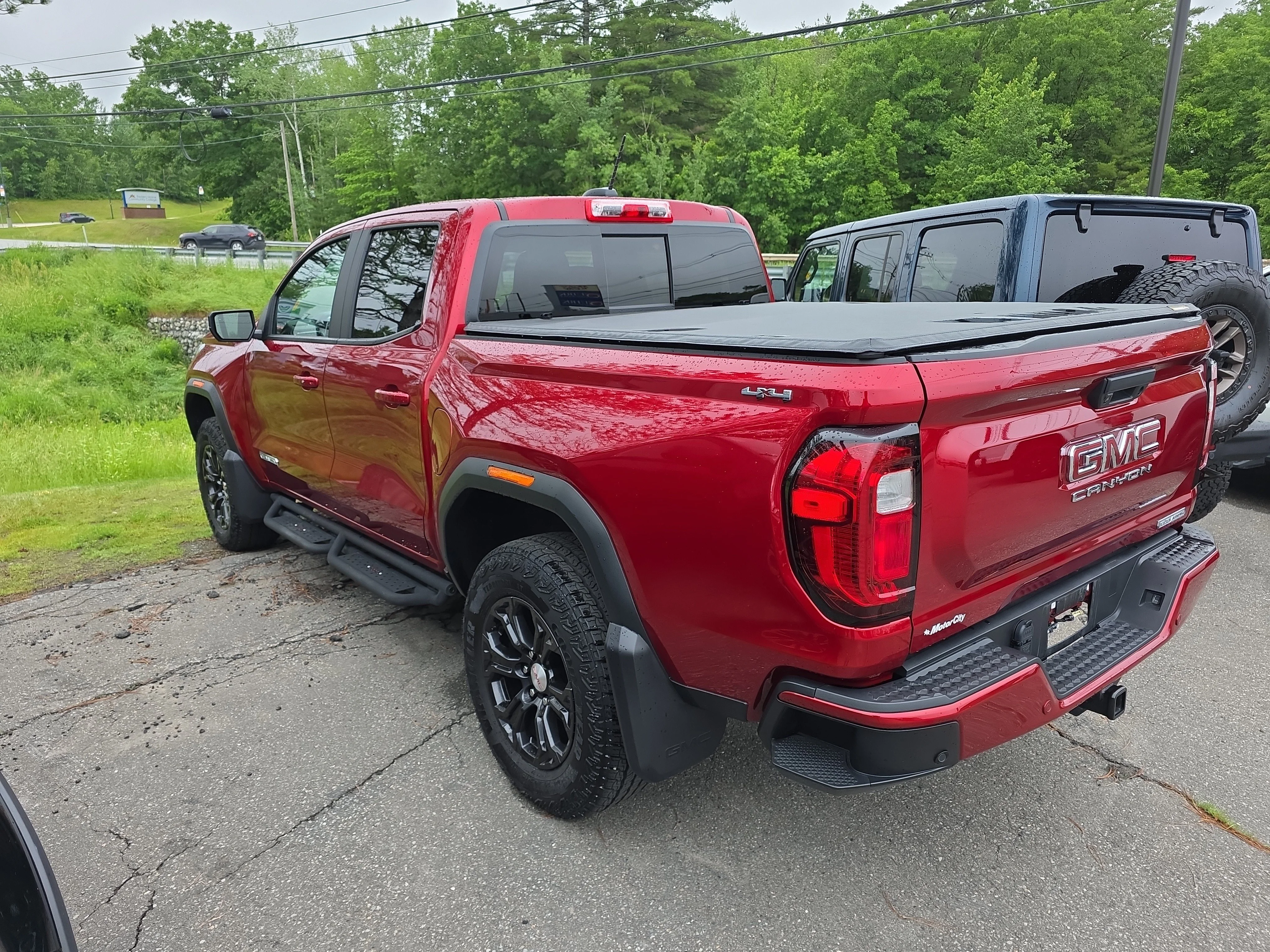 Used 2024 Volcanic Red Tintcoat GMC 4WD Elevation image 2
