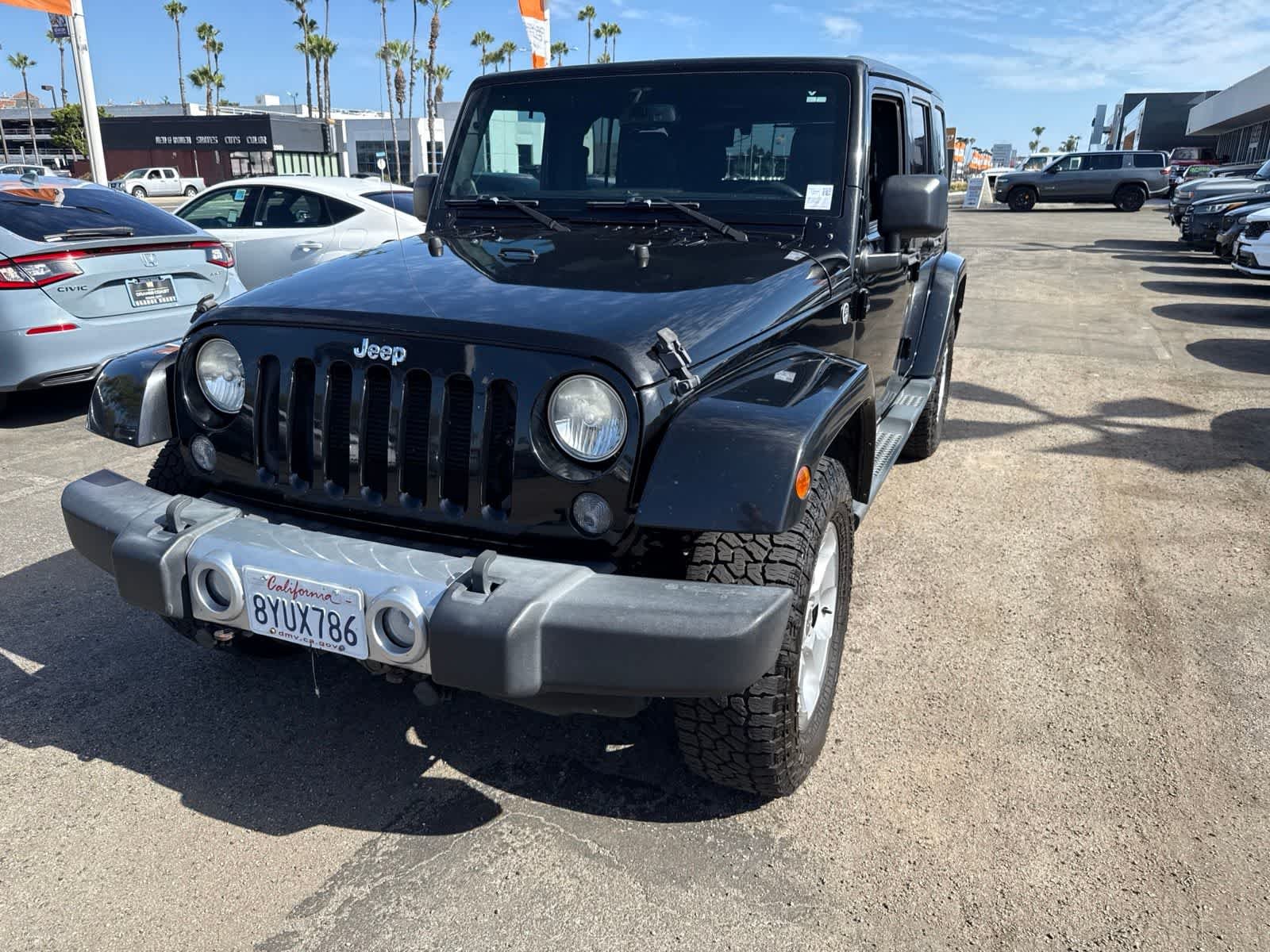 Used 2014 Jeep Wrangler Unlimited Sahara with VIN 1C4BJWEG7EL105414 for sale in Costa Mesa, CA