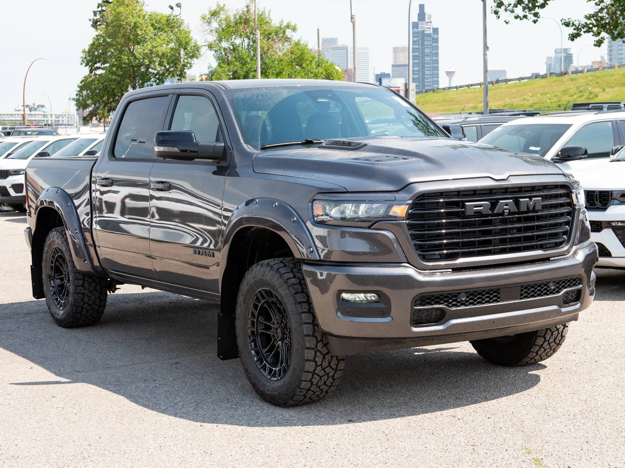 New 2026 Grey RAM Sport* Crew Cab 4x4, 3.5 Inch Lift, 35 Inch Tires, Fuel Wheels, Trigger Industries Mudflaps image 8
