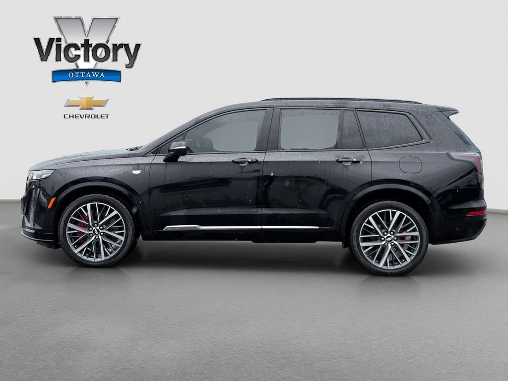 Used 2023 Stellar Black Metallic Cadillac Sport image 3