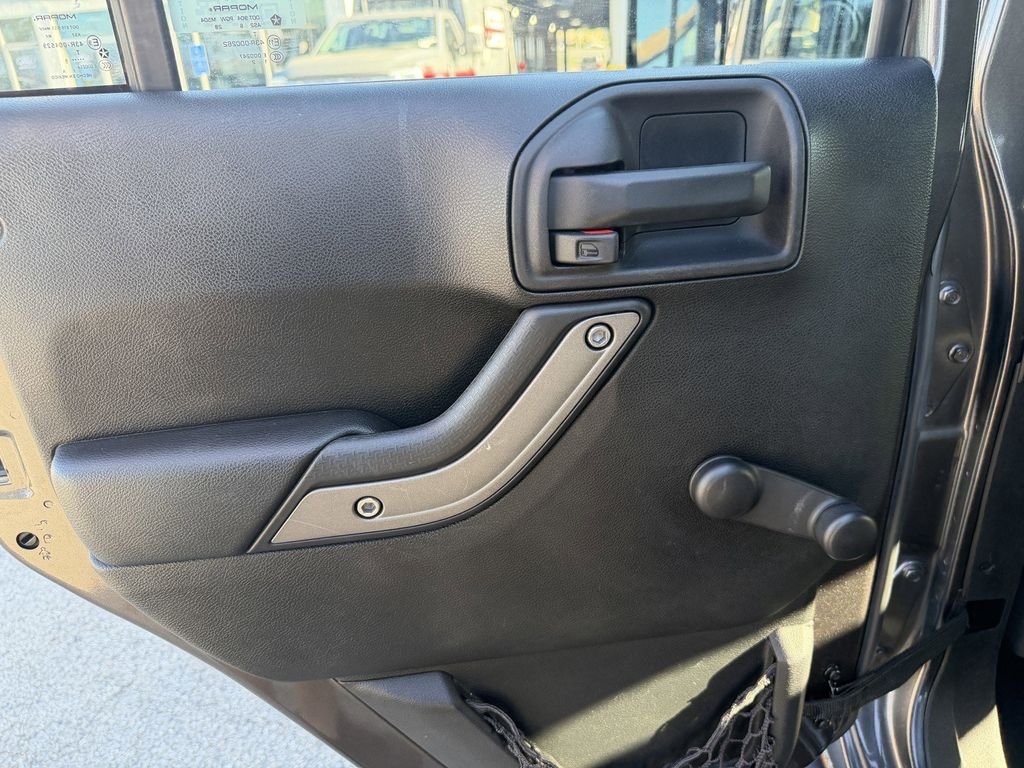 Used 2016 Granite Crystal Clearcoat Metallic Jeep Unlimited Sport image 22